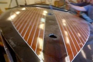 Slide: The Image of 1931 Hacker-Craft 26 Dolphin wooden boat with polished deck in workshop. - 252