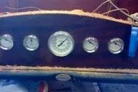 Slide: The Image of Dashboard of a 1931 Hacker-Craft 26 Dolphin boat with vintage gauges. - 26