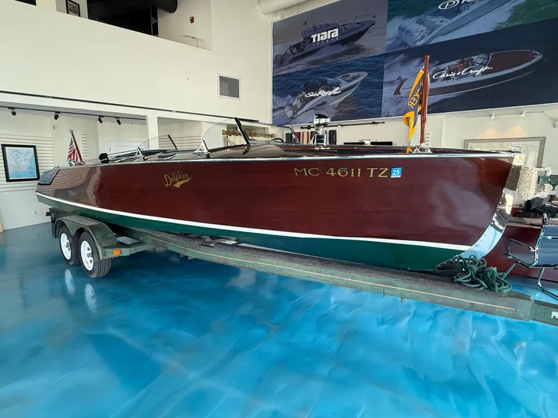 Slide: The Image of Vintage 1931 Hacker-Craft 26 Dolphin boat displayed indoors on a trailer. - 3