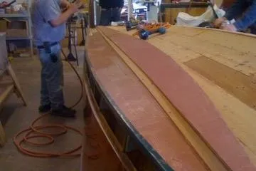 Slide: The Image of Restoration work on a 1931 Hacker-Craft 26 Dolphin boat in a workshop. - 31