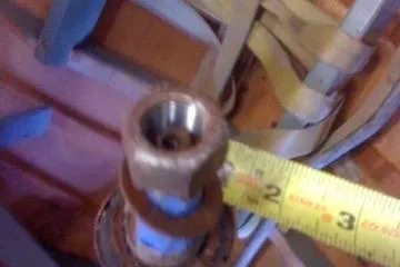 Slide: The Image of Close-up of a 1931 Hacker-Craft 26 Dolphin component with a measuring tape. - 34
