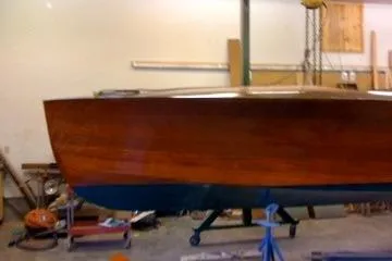 Slide: The Image of 1931 Hacker-Craft 26 Dolphin wooden boat in a workshop setting. - 51