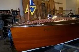 Slide: The Image of 1931 Hacker-Craft 26 Dolphin wooden boat in a workshop setting. - 70