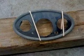 Slide: The Image of Dashboard panel from a 1931 Hacker-Craft 26 Dolphin boat, resting on wood. - 74