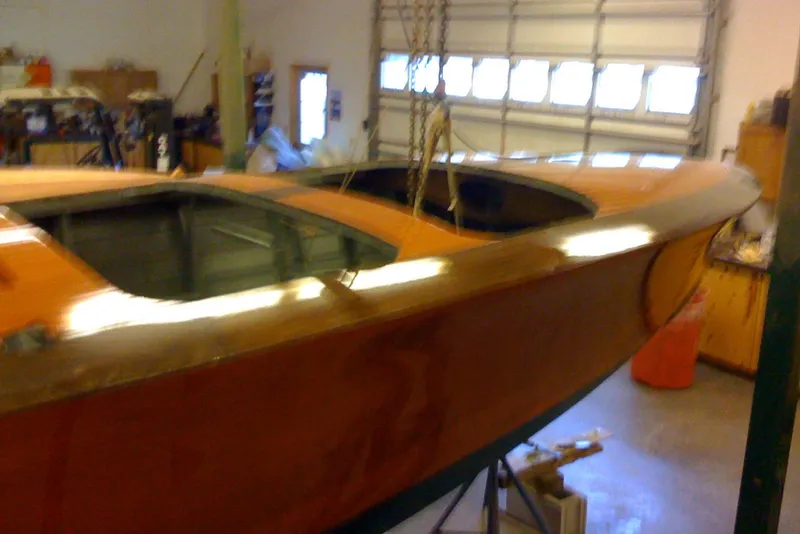 Slide: The Image of 1931 Hacker-Craft 26 Dolphin wooden boat in a workshop setting. - 83