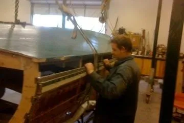 Slide: The Image of Person working on 1931 Hacker-Craft 26 Dolphin boat restoration in workshop. - 97