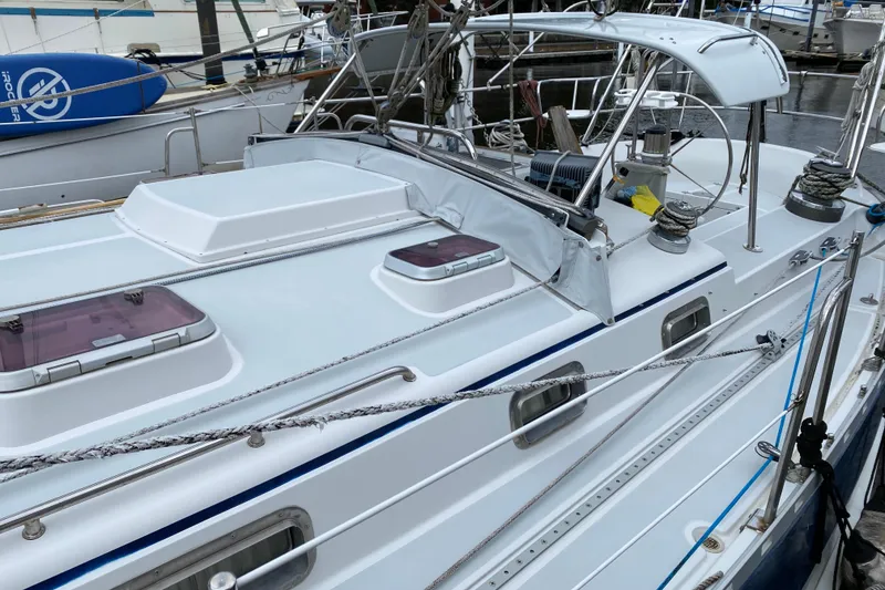 Slide: The Image of 2007 Valiant 50 sailboat deck with rigging and hatches in a marina. - 13