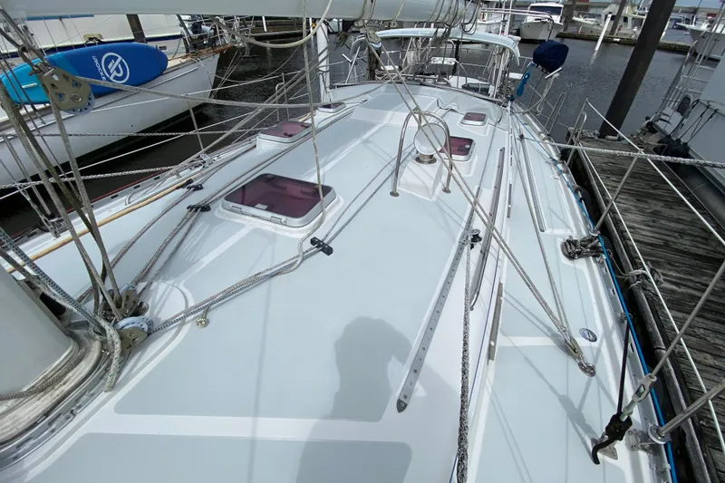 Slide: The Image of Deck view of a 2007 Valiant 50 sailboat, showcasing rigging and hatches. - 2
