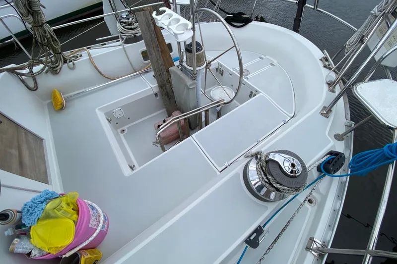 Slide: The Image of 2007 Valiant 50 sailboat deck with ropes, winch, and cleaning supplies. - 8