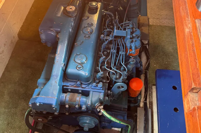 Slide: The Image of Engine of a 1984 Monk 36 Trawler, showcasing detailed mechanical components. - 30