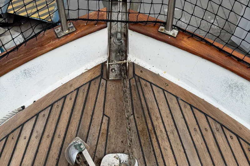 Slide: The Image of Bow of 1984 Monk 36 Trawler with wooden deck and anchor chain. - 6