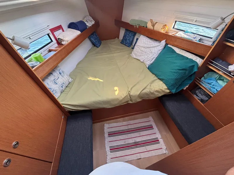 Slide: The Image of Cozy cabin interior of 2014 Bavaria 36 Cruiser sailboat with bed and storage. - 16