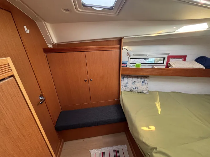 Slide: The Image of Cozy cabin interior of 2014 Bavaria 36 Cruiser yacht with wooden furnishings. - 18