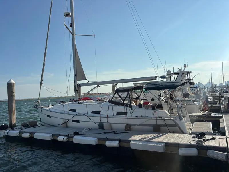 Slide: The Image of Bavaria 36 Cruiser 2014 docked at marina, clear sky, calm waters. - 21