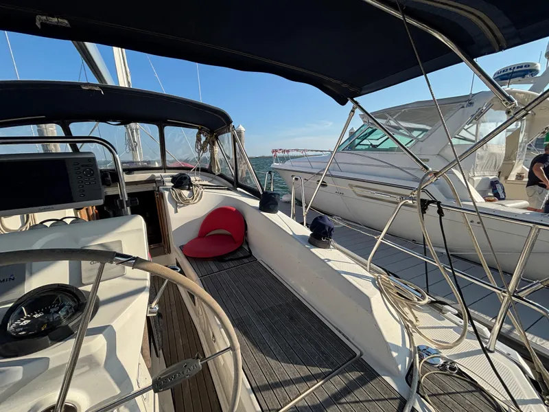 Slide: The Image of Interior view of a 2014 Bavaria 36 Cruiser sailboat with steering wheel and navigation equipment. - 23