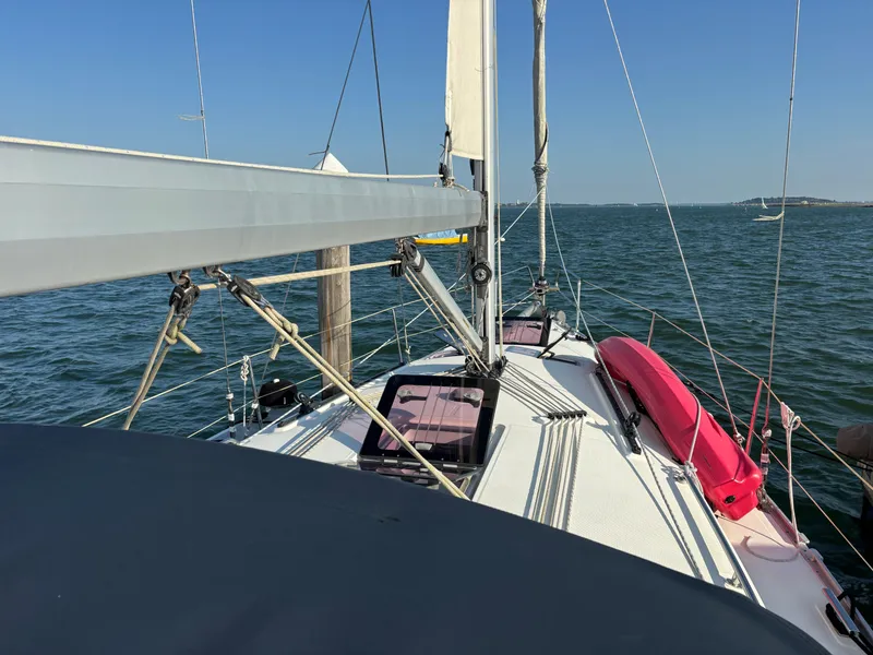 Slide: The Image of Bavaria 36 Cruiser 2014 sailing on open water under clear blue sky. - 25