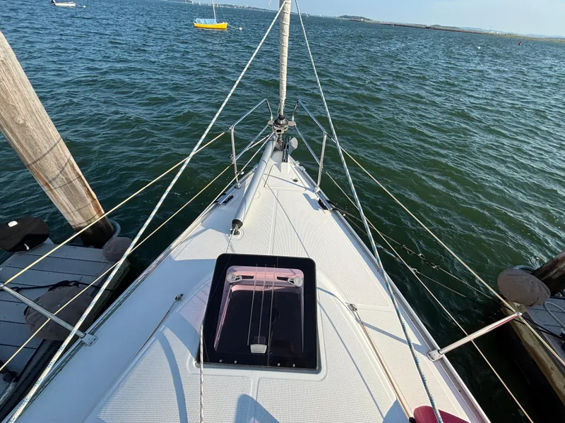 Slide: The Image of 2014 Bavaria 36 Cruiser sailboat docked on calm water, viewed from the deck. - 27