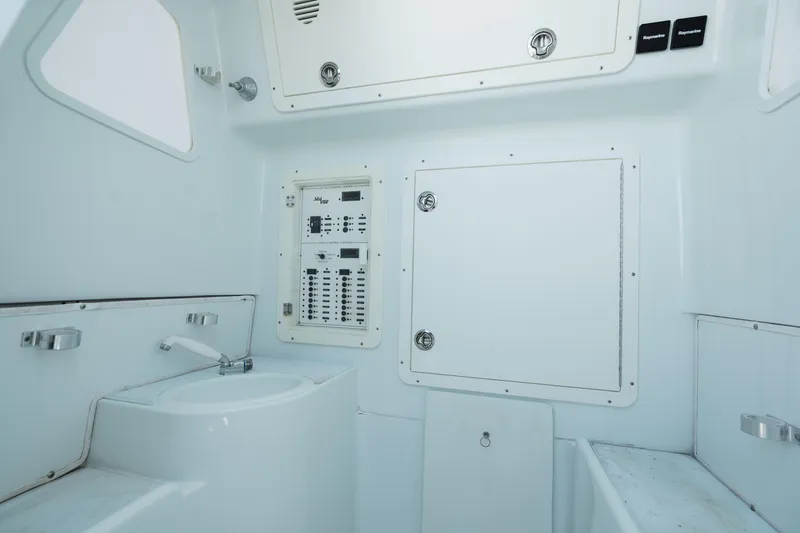 Slide: The Image of Interior of 2017 SeaVee Z39 boat featuring control panel and sink. - 23