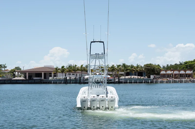 Slide: The Image of 2017 SeaVee Z39 boat cruising on a sunny day near waterfront homes. - 8