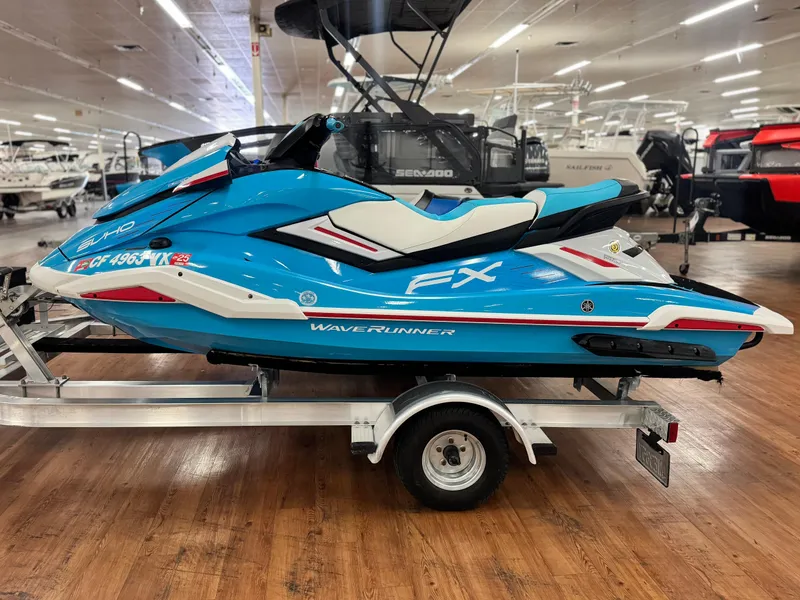 Slide: The Image of 2022 Yamaha WaveRunner FX SVHO in showroom, blue and white, on trailer. - 13