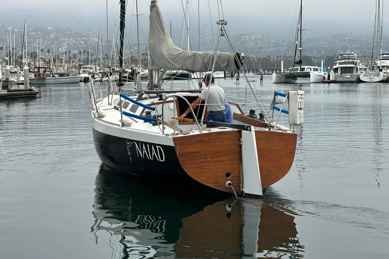 Slide: The Image of Sailboat "Naiad" by C & B Marine, 1976, docked in a marina. - 5