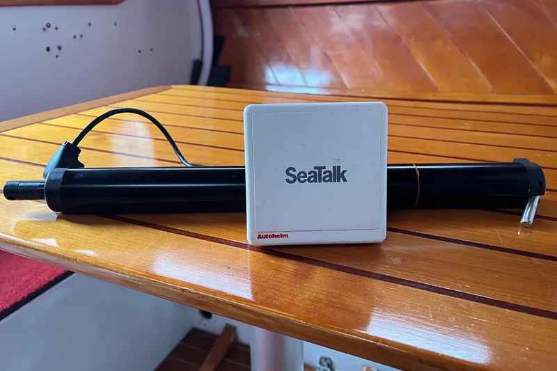 Slide: The Image of Autopilot system on wooden boat interior, featuring SeaTalk and Autohelm components, 1976 C&B Marine. - 9