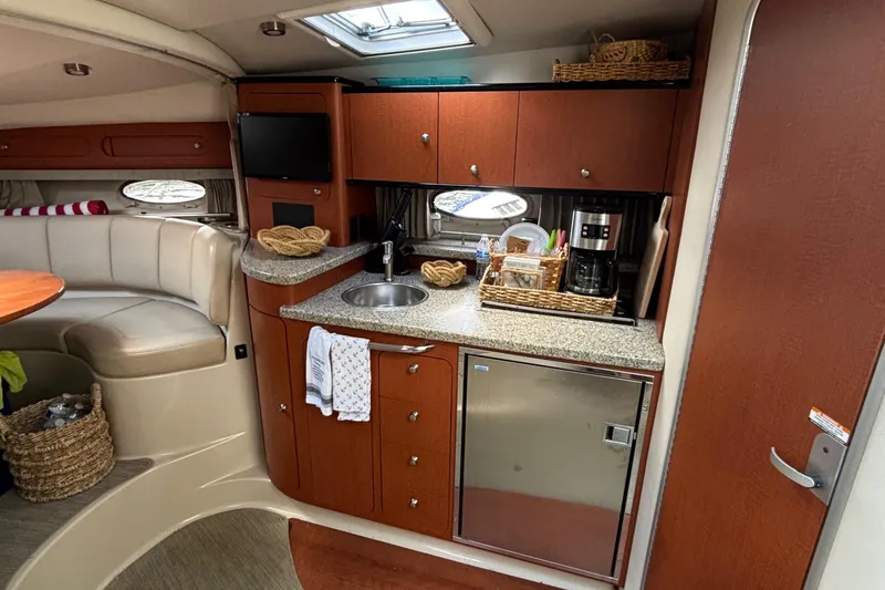 Slide: The Image of Interior of 2005 Chaparral Signature 330 yacht with kitchenette and seating area. - 12