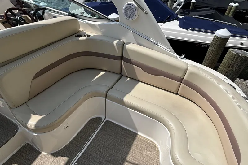 Slide: The Image of 2005 Chaparral Signature 330 boat interior with beige seating and wood accents. - 4