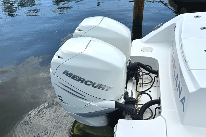 Slide: The Image of 2017 Boston Whaler 330 Outrage with twin Mercury outboard engines on water. - 23