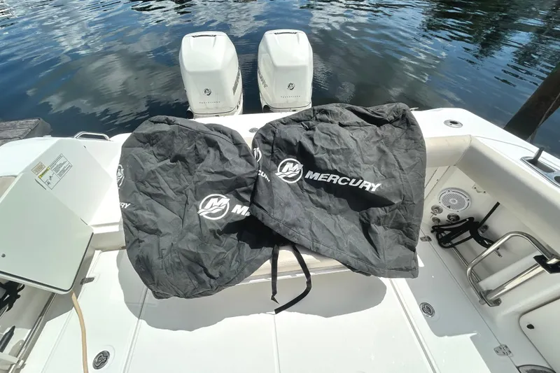 Slide: The Image of 2017 Boston Whaler 330 Outrage with Mercury engine covers on deck. - 24
