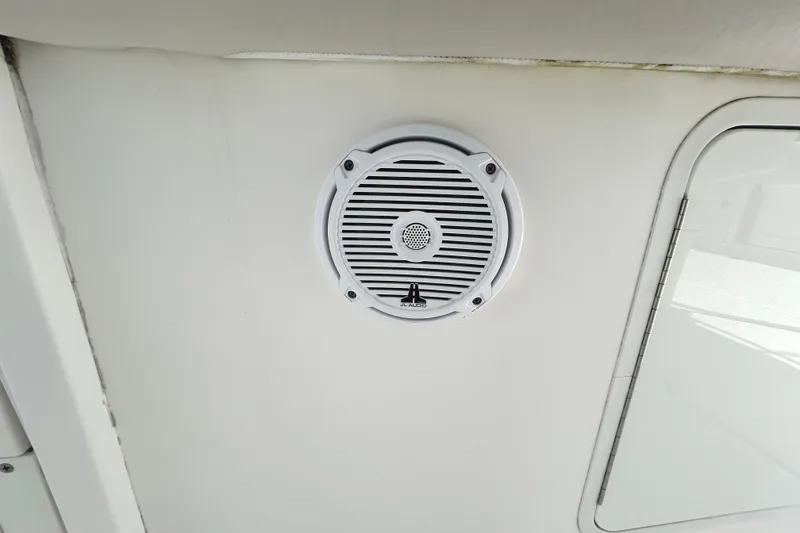 Slide: The Image of Speaker on 2017 Boston Whaler 330 Outrage boat ceiling, near a hatch. - 36
