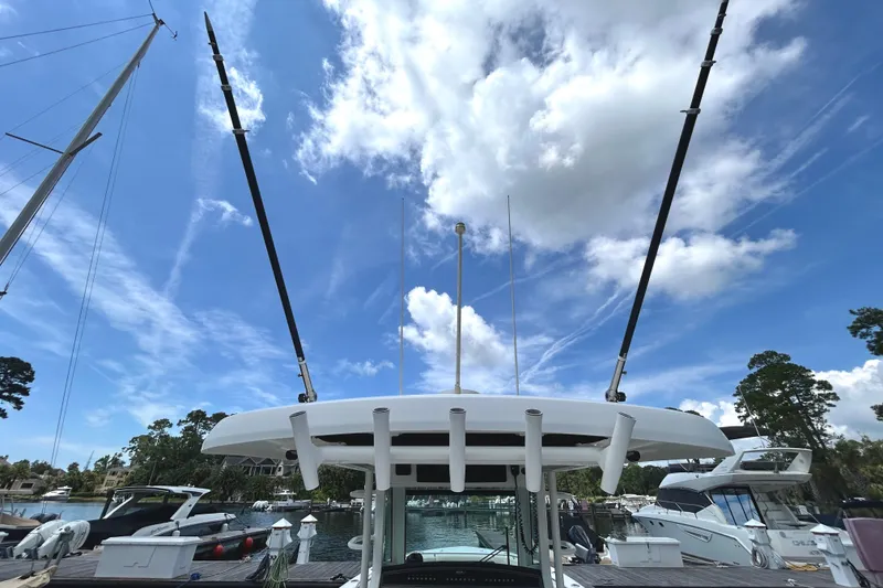 Slide: The Image of Boston Whaler 330 Outrage 2017 boat docked under a bright blue sky. - 8