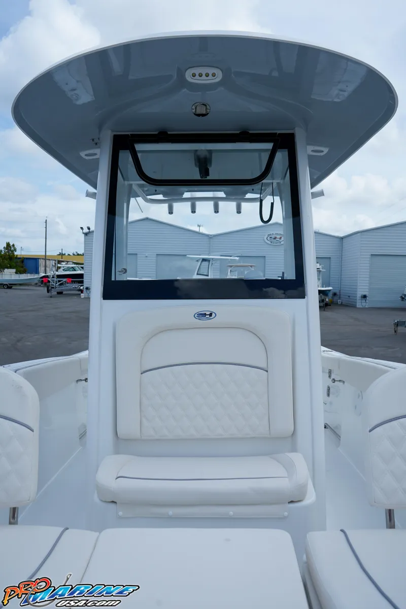 Slide: The Image of 2026 Sea Hunt Ultra 255 SE boat interior with open storage compartments. - 11