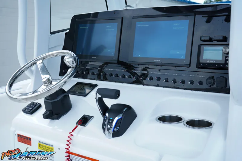 Slide: The Image of 2026 Sea Hunt Ultra 255 SE boat with white cushioned seating. - 14