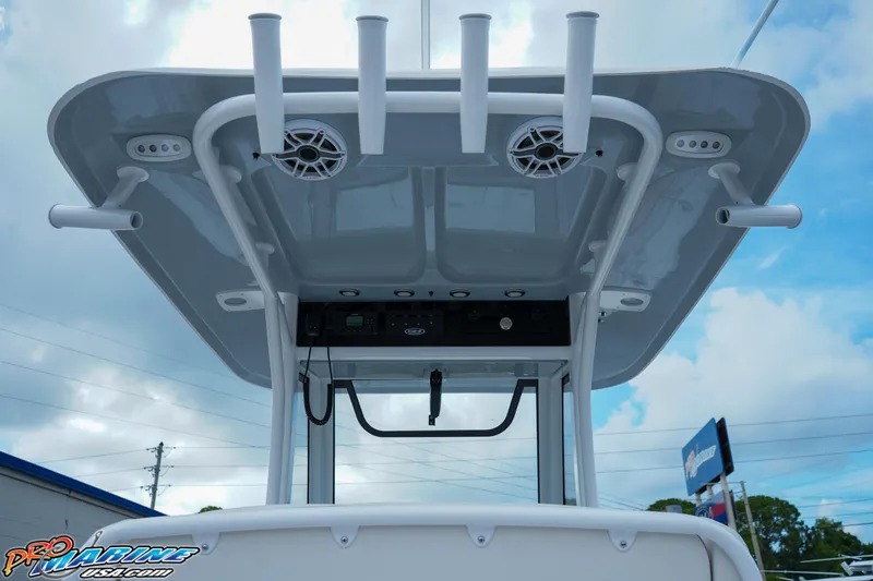 Slide: The Image of 2026 Sea Hunt Ultra 255 SE boat T-top with rod holders and speakers. - 18