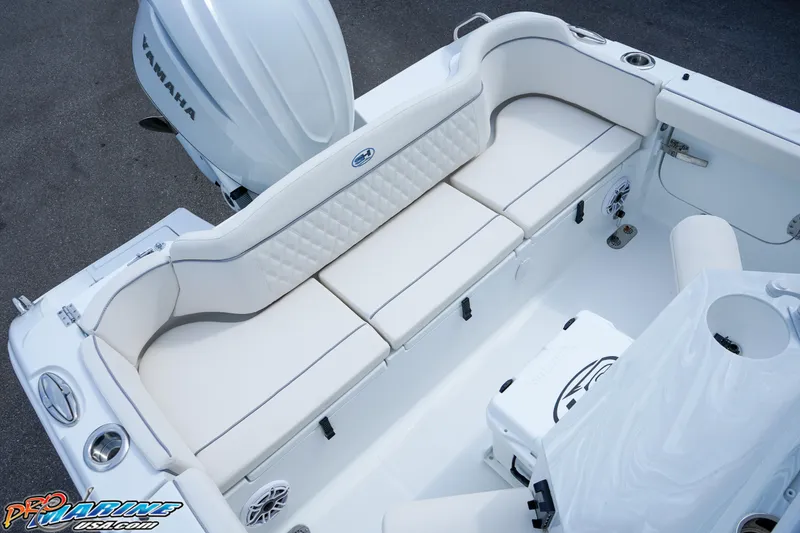 Slide: The Image of 2026 Sea Hunt Ultra 255 SE boat interior with Yamaha engine, featuring storage and seating. - 22
