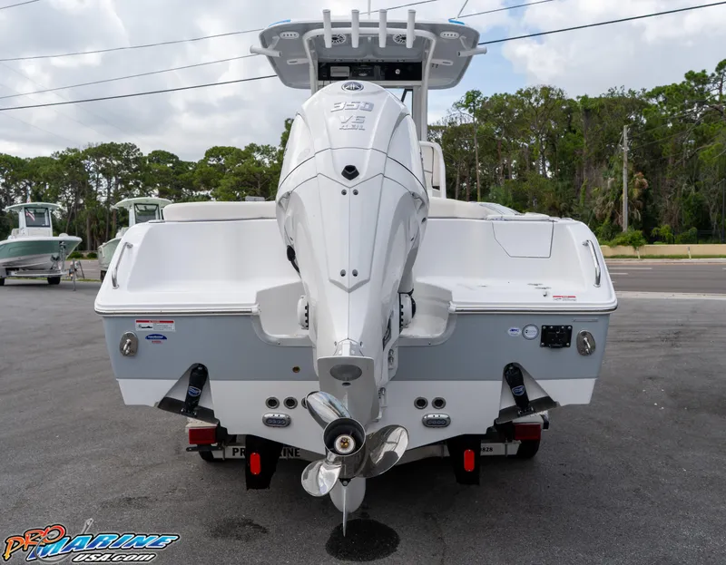 Slide: The Image of 2026 Sea Hunt Ultra 255 SE boat on trailer, displayed outdoors. - 3
