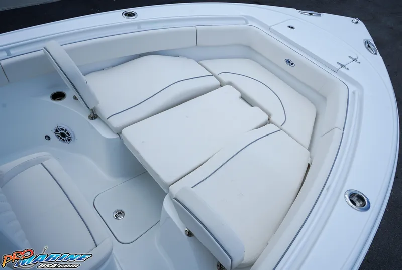 Slide: The Image of 2026 Sea Hunt Ultra 255 SE boat interior with white cushioned seating. - 8