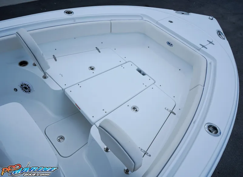 Slide: The Image of 2026 Sea Hunt Ultra 255 SE boat with white cushioned seating area. - 9