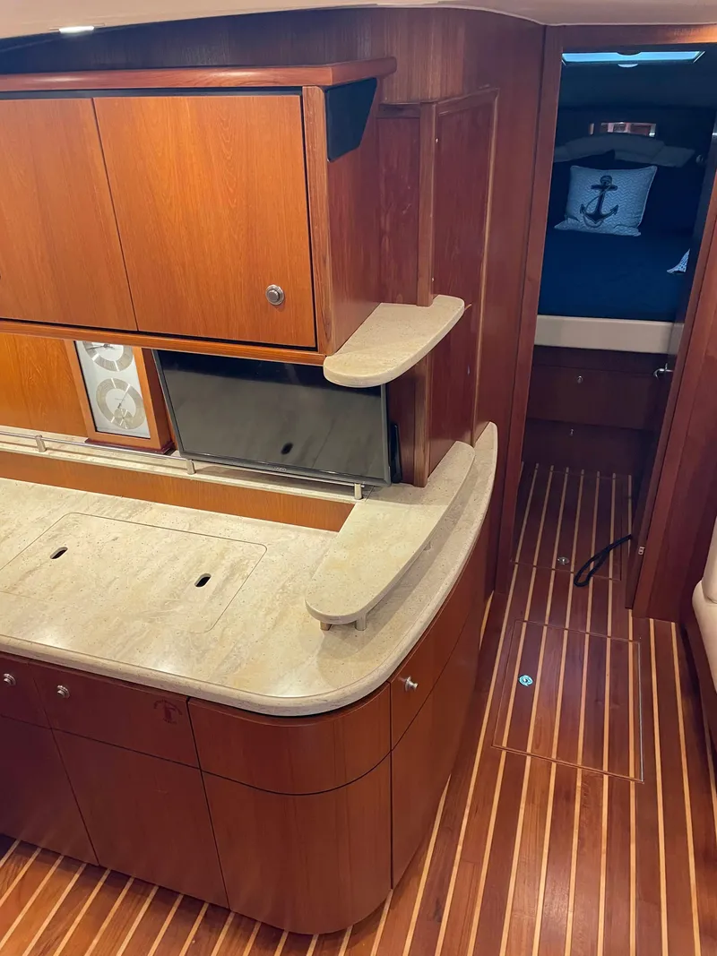 Slide: The Image of 2009 Tiara Yachts 4300 Sovran interior with wooden cabinetry and modern design. - 12