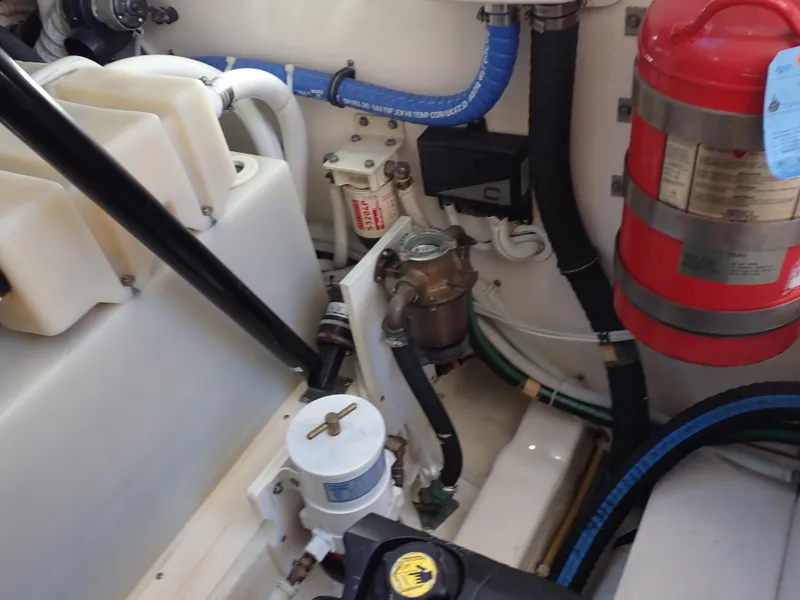 Slide: The Image of Engine compartment of 2009 Tiara Yachts 4300 Sovran with fire extinguisher and hoses. - 23