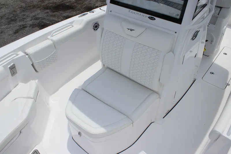 Slide: The Image of 2026 Tidewater 272 LXF boat interior with white cushioned seating and sleek design. - 11