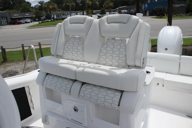 Slide: The Image of 2026 Tidewater 272 LXF boat with luxurious white seating and modern design. - 14