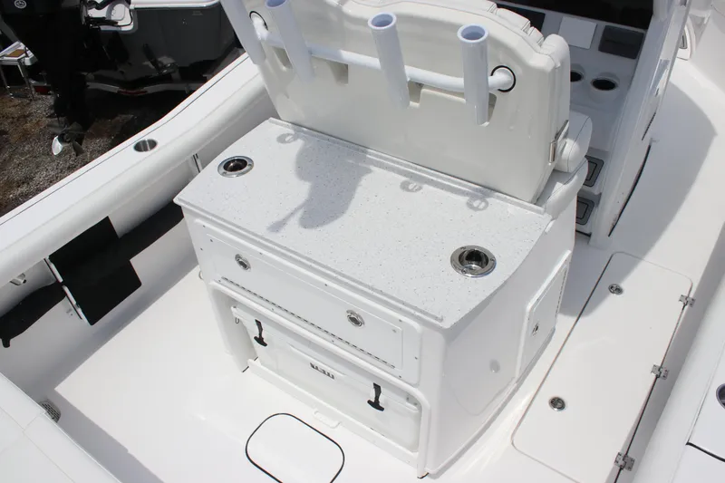 Slide: The Image of 2026 Tidewater 272 LXF boat interior with fishing rod holders and storage compartments. - 15