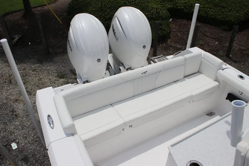Slide: The Image of 2026 Tidewater 272 LXF boat with dual Yamaha engines and white seating. - 16