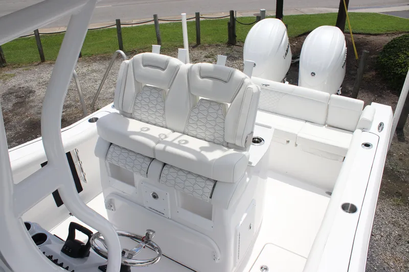 Slide: The Image of 2026 Tidewater 272 LXF boat interior with dual seats and twin engines. - 17