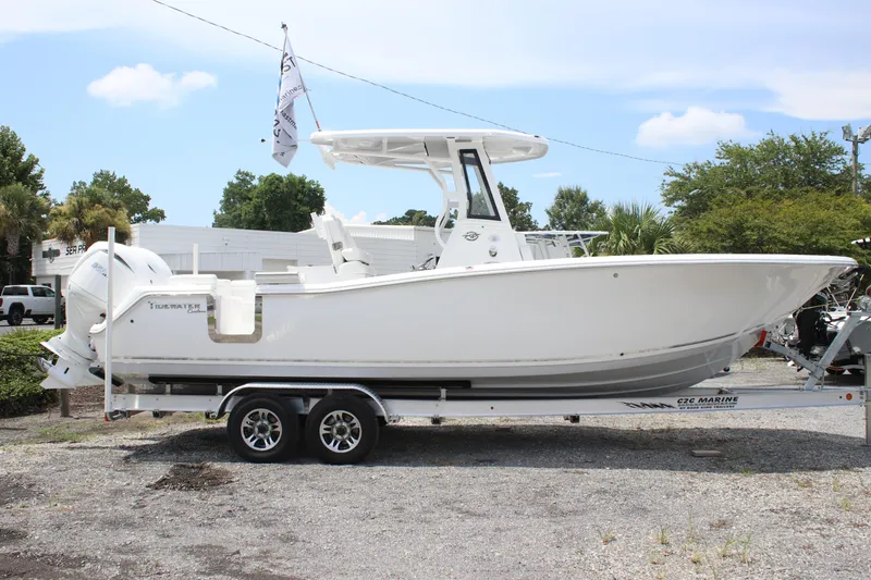 Slide: The Image of 2026 Tidewater 272 LXF boat on trailer, side view, outdoors, clear sky. - 28