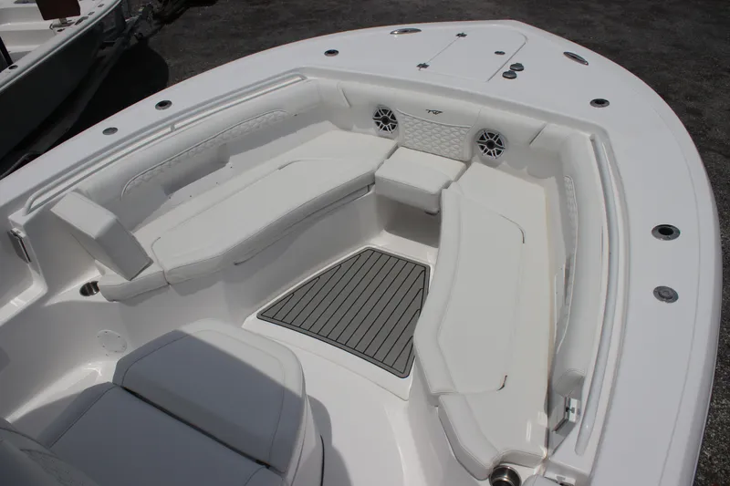 Slide: The Image of 2026 Tidewater 272 LXF boat interior with white seating and deck. - 6