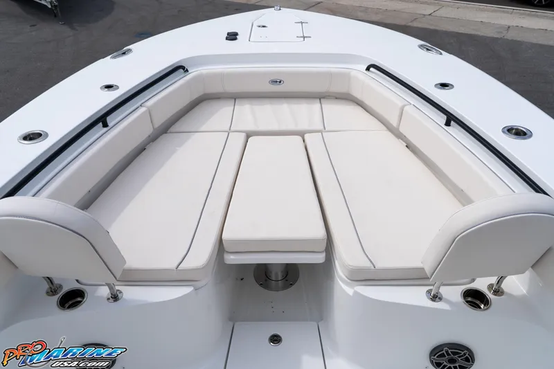 Slide: The Image of 2026 Sea Hunt Gamefish 30 boat interior with white cushioned seating and sleek design. - 14