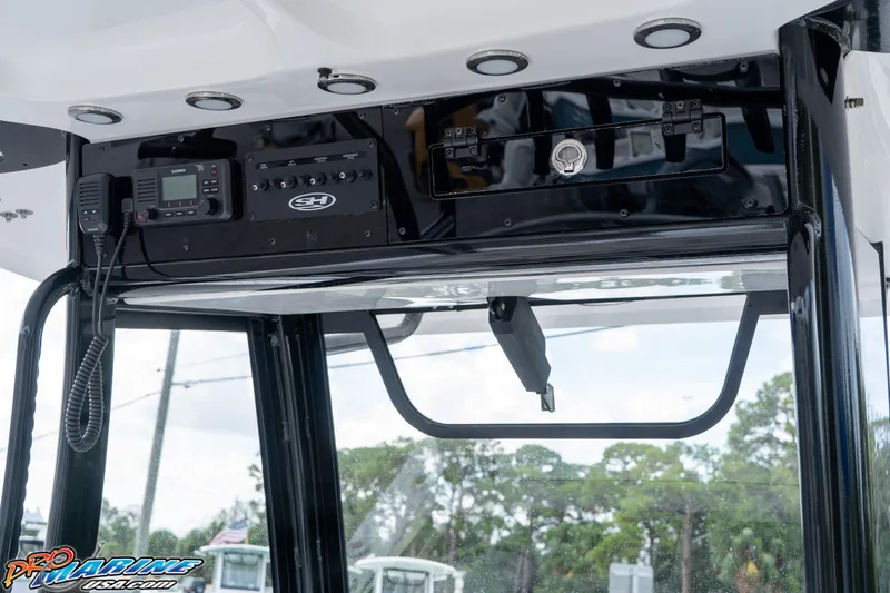 Slide: The Image of 2026 Sea Hunt Gamefish 30 boat console with electronics and controls. - 22